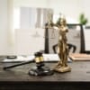 A lawyer's desk in the office is filled with legal documents.The lawyer provides consultations