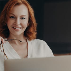 Indoor shot of professional woman copywriter works on creation advertising content